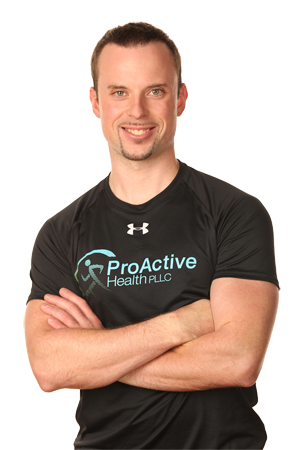 Example of a knockout headshot, Proactive Health owner standing with his arms crossed, and no background.